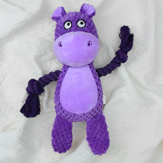 jouet Peluche pour chien sur couverture